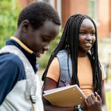 Two African teens walking to school